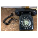 Black rotary dial desk phone