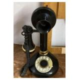 Black rotary dial candlestick phone