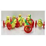 9 plastic penguin nodder bird toys on wheels