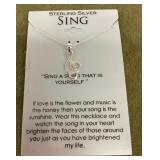 Sterling silver treble clef necklace