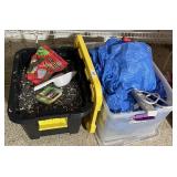 Tote of birdseed, tote of tarps