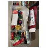 Tote of wrapping paper, bows, boxes