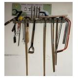 Long handle tools on garage wall