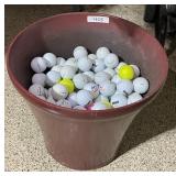 Large planter pot full of golf balls