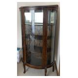 Antique curved glass oak curio cabinet
