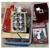 Plastic tote of Christmas ornaments, gift boxes