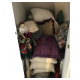 Contents of closet with throw pillows & soft goods