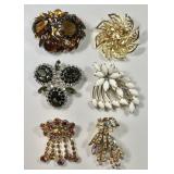 6 large rhinestone & goldtone brooches