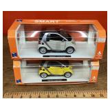 Two diecast Smart Cars