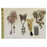4 costume jewelry brooches & money clip