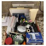 Flat of office supplies and jewelry cleaner