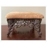 Ornate cast iron footstool