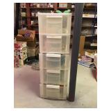 Plastic organizer with drawers and contents