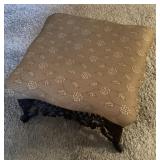 Ornate cast iron footstool