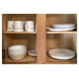 Corelle dishes in cabinet