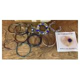 Collection of costume bracelets and brooch