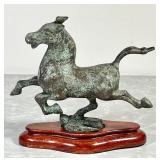 Bronzed cast iron horse on wooden base
