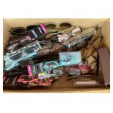 Box of eye glasses and sunglasses