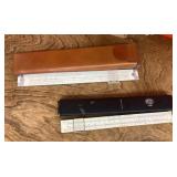 2 slide rules with cases