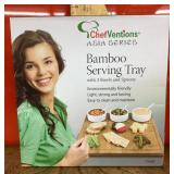 Bamboo serving tray with bowls and spoons