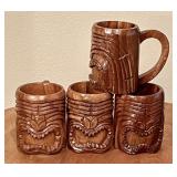 4 carved wood tiki mugs