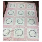 Embroidered pink and white quilt 66" x 85"