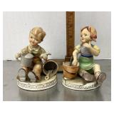 Boy and girl porcelain figures