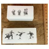 Snow village skater and baker elves figures