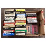 Group of 8-track tapes and cassettes