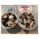 Two containers of buttons