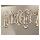Collection of 11 white beaded necklaces