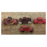 4 cast-iron toy trucks
