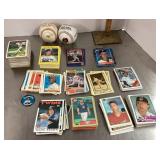 Box of baseball cards and 2 baseballs