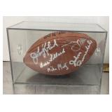 Autographed football in display case
