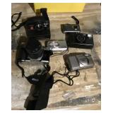 4 digital cameras, Pentax ZX-10, Polaroid