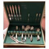 Assorted flatware in tole painted box