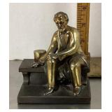 Seated Abe Lincoln figure