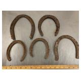 5 old horseshoes
