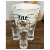 Plastic Miller Lite bucket and 3 pilsner glasses