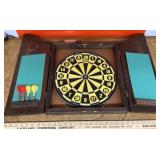 Dart board in wall case
