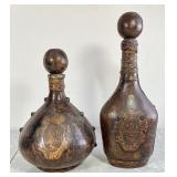 2 tooled leather wrapped glass decanters Italy