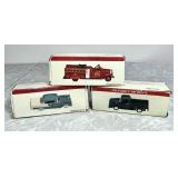 3 diecast vehicles in boxes