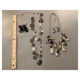 Two mirrored metal jewelry sets