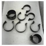 Piston ring compressors