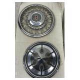 2 vintage hubcaps