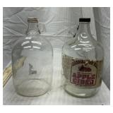 2 gallon-size glass apple cider jugs