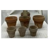 7 clay flower pots