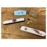 Lipstick holders, hat pins, folding combs