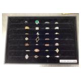 Group of costume jewelry rings with tray