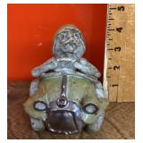 Studio pottery figure of man driving car